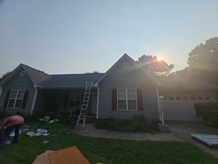 Eastern Oak Roofing crew starting a roof replacement at sunrise